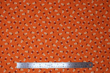 Flat swatch Candy Corn Orange fabric (deep orange fabric with tossed candy corn with ornate/decorative pattern in orange sections)