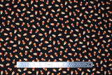 Flat swatch Candy Corn Black fabric (black fabric with tossed candy corn with ornate/decorative pattern in orange sections)