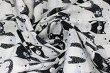Swirled swatch Friends fabric (stacked cartoon/illustrative style cats, bears, hedgehogs etc in black and white shades)