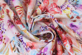 Swirled swatch warm fabric (white fabric with large watercolour look floral allover in purple, red, brown, yellow, blue)