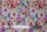 Flat swatch warm fabric (white fabric with large watercolour look floral allover in purple, red, brown, yellow, blue)