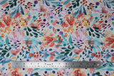 Flat swatch cool fabric (white fabric with large tossed floral heads, stems and dots in watercolour look in blue, red, purple, orange, yellow colourway)
