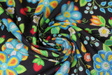 Swirled swatch Black fabric (black fabric with large tossed beaded/bubble look floral and greenery allover in white, blues, yellow, orange, red)