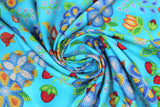 Swirled swatch Turquoise fabric (turquoise fabric with large tossed beaded/bubble look floral and greenery allover in white, blues, yellow, orange, red)