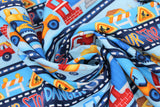 Swirled swatch Detour fabric (illustrative construction scene fabric in stripes with related text "Detour" "Slow" etc)
