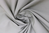 Swirled swatch Broadcloth Solid fabric in shade Celadon (pale grey/green)