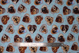 Flat swatch Hearts fabric (pale blue fabric with paw prints in background and tossed heart badges allover with dog faces within)