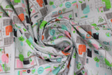 Swirled swatch home office fabric (white fabric with tossed home office graphic incl. desk setup and various chairs in green, pink, orange)