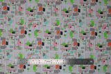Flat swatch home office fabric (white fabric with tossed home office graphic incl. desk setup and various chairs in green, pink, orange)