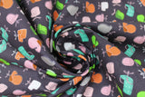 Swirled swatch chair toss fabric (black fabric with small tossed office chair graphics in grey, white, pink, brown, green, teal)