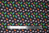 Flat swatch chair toss fabric (black fabric with small tossed office chair graphics in grey, white, pink, brown, green, teal)