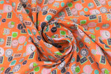 Swirled swatch deadlines fabric (orange fabric with tossed clocks: wall clocks, alarm clocks, circular and rectangle clocks in various styles and colours allover)