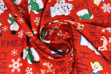Swirled swatch red fabric (red fabric with brown character name texts allover horizontal and vertical "Rudolph" "Clarice" etc. with tossed full colour movie characters and snowflakes)