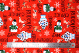 Flat swatch Rudolf the Red Nosed Reindeer licensed print fabric on red