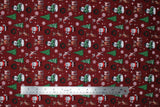 Flat swatch Reindeer Games fabric (red fabric with tossed rudolph cartoon emblems allover with trees, snowflakes, and characters, etc.)