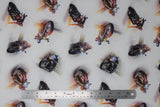 Flat swatch motorcycle toss fabric (white fabric with tossed motorcycles and drivers alllover)