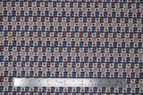 Flat swatch American rustic fabric (grey fabric with repeated lines of "USA" text in stripes with stars in between, blue, red colourway and some white with blue, black, red outlines)