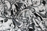 Swirled swatch Nightmare Before Christmas themed fabric (white fabric with black NBC sketches Jack and Sally, Halloweentown, etc.)