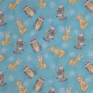 Square swatch white woodland fabric (pale blue fabric with tossed woodland creatures, owls, racoons, bunnies, foxes and white snowflakes allover)
