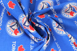 Swirled swatch licensed Toronto Blue Jays printed fabric in cotton (blue with multi logo/text)