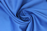 Swirled swatch poly/cotton blend solid fabric in shade royal blue