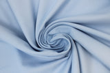 Swirled swatch poly/cotton blend solid fabric in shade light blue