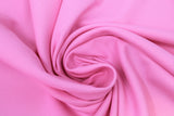 Swirled swatch poly/cotton blend solid fabric in shade pink