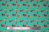 Flat swatch Super Mario Bros (licensed) print fabric in Super Mario Badges (Mario, Luigi, Peach and Yoshi character badges on light turquoise)