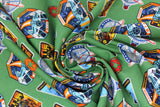Swirled swatch licensed Star Wars badges fabric in Imperial Badges Toss (multi shape combat badges on green)
