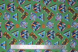 Flat swatch licensed Star Wars badges fabric in Imperial Badges Toss (multi shape combat badges on green)