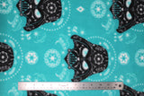 Flat swatch Darth Vader Sugar Skulls fabric (light turquoise fabric with black darth vader heads with white floral drawing decor, sugar skull applique designs in background in white)