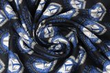 Swirled swatch Legendary Warriors fabric (navy fabric with repeated mandalorian badges in blue and grey with helmet in white repeated)