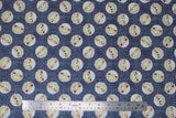 Flat swatch licensed Star Wars (The Child) printed fabric in Child Toss on Denim (baby yoda circle pattern on denim look fabric)