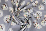 Swirled swatch licensed Star Wars (The Child) printed fabric in Mando and Child Toss (trooper and baby yoda in circles on grey)