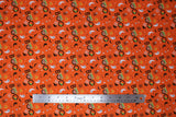 Flat swatch peekaboo child fabric (orange fabric with tiny tossed halloween elements: black and white ghosts, black bats, black and white spider webs, orange jack-o-lanterns and black "BOO" text with the child coming out of first O)