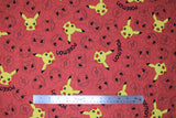 Flat swatch Pikachu fabric (pale red fabric with tossed coloured Pikachu heads, and tossed pokemon head outlines, pokeball outlines, and "Pokemon" text in black)