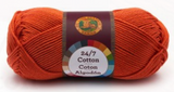 A single ball of Lion Brand 24/7 Cotton in Tangerine