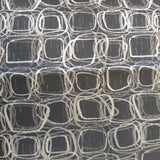 Square swatch upholstery fabric with tiled doodle circles and square print pattern allover (darkest grey fabric with light grey and white pattern)
