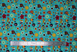 Flat swatch aqua fabric (aqua/light blue green coloured fabric with tossed brightly coloured drawn birds and flowers allover in various styles sizes in the colourway: yellow, red, orange, mint, black)