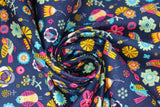 Swirled swatch navy fabric (dark navy blue coloured fabric with tossed brightly coloured drawn birds and flowers allover in various styles sizes in the colourway: yellow, red, orange, mint, black)