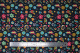Flat swatch navy fabric (dark navy blue coloured fabric with tossed brightly coloured drawn birds and flowers allover in various styles sizes in the colourway: yellow, red, orange, mint, black)