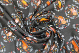 Swirled swatch dog days autumn fabric (black fabric with tossed brown dogs in autumn sweaters in circular badges made up of greenery and mushrooms)