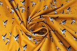 Swirled swatch Canadian Geese fabric (golden orange fabric with small Canadian geese in flight allover)