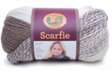 A ball of Lion Brand Scarfie on white background in shade cream taupe (white, taupe, marled and solid colourway)