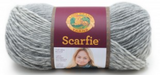 A ball of Lion Brand Scarfie on white background in shade cream silver (white, light greys marled and solid colourway)