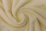 Swirled swatch terry cloth solid in shade yellow