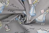 Swirled swatch Alice in Wonderland fabric (grey fabric with tossed illustrative Alice in Wonderland character and emblems and text)