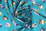 Swirled swatch Villains Gather fabric (teal fabric with tossed cartoon disney villains (female) in stubby pop figure style size allover)
