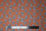 Flat swatch peach fabric (peach orange fabric with white dots allover and tossed coloured dumbo cartoon characters in various poses allover)