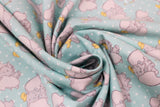 Swirled swatch light blue fabric (light blue fabric with white dots allover and tossed coloured dumbo cartoon characters in various poses allover)